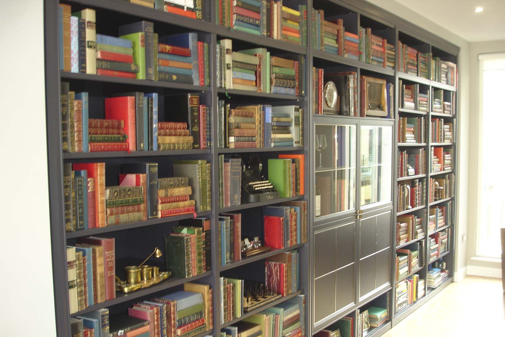 Decorative books dressing shelves in a restaurant interior