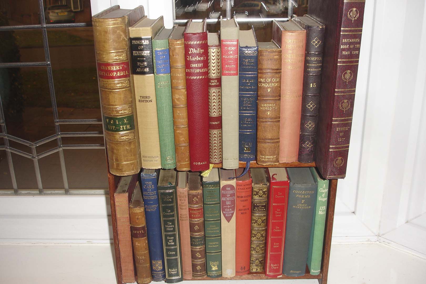 Vintage leather books styled on shelving at a London hotel