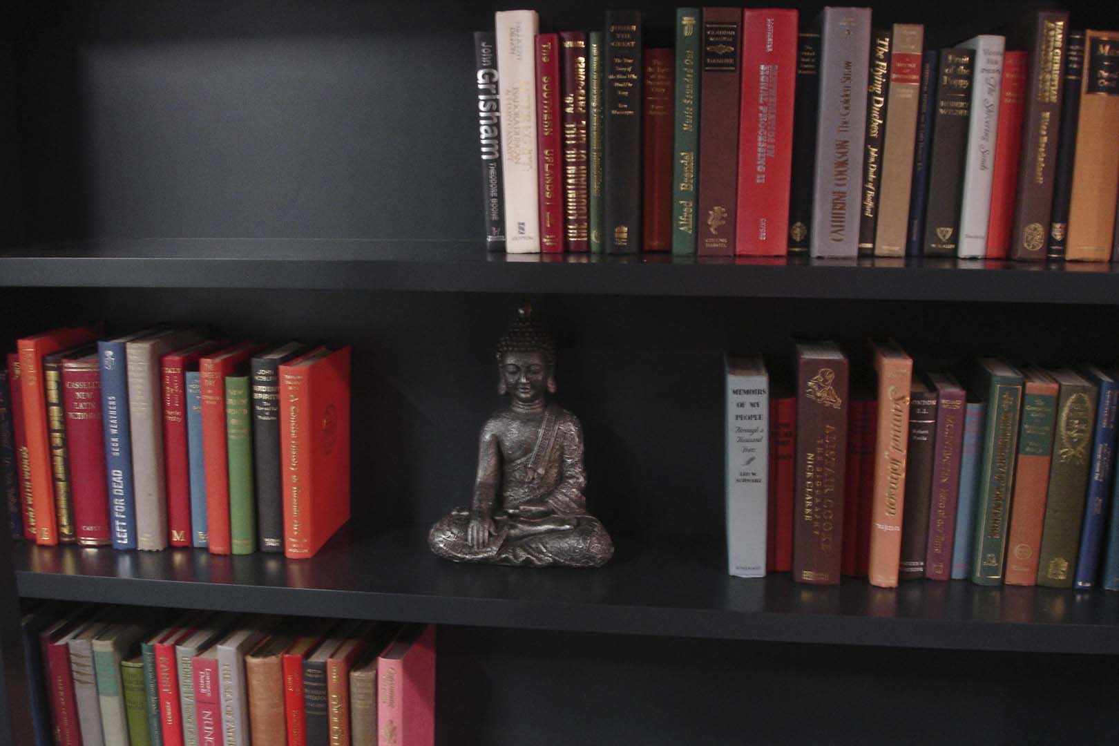 Vintage leather bound antique books on a shelf
